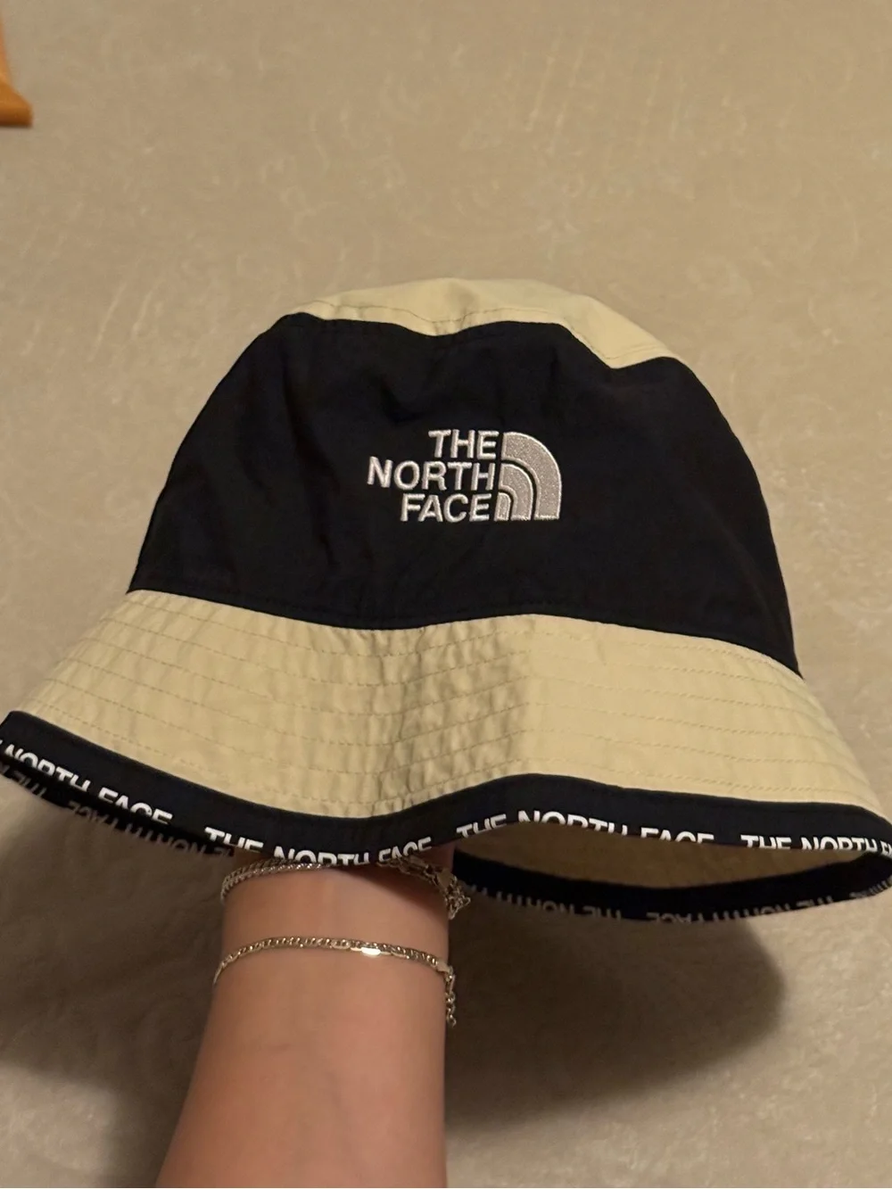 The North Face Two-Tone Black and Cream Bucket Hat